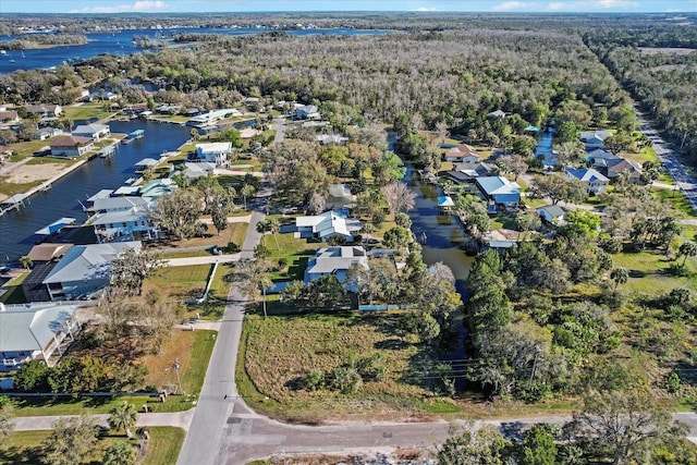 drone / aerial view featuring a residential view and a water view