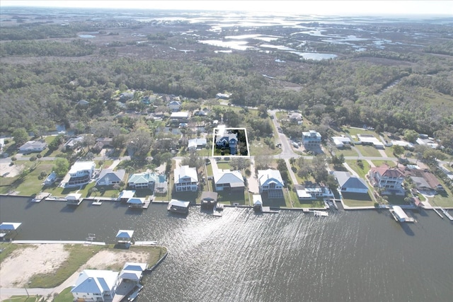 bird's eye view with a residential view and a water view