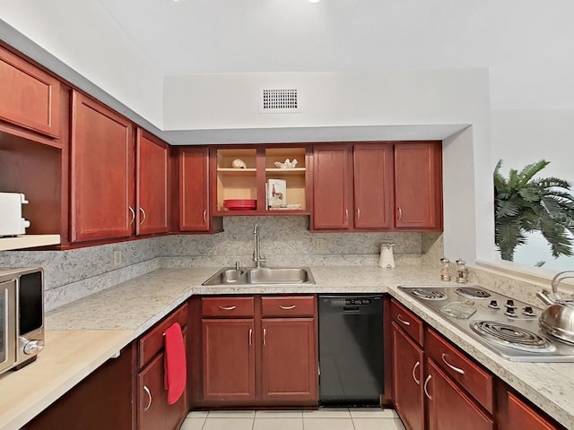 kitchen featuring stainless steel appliances, visible vents, a sink, and open shelves