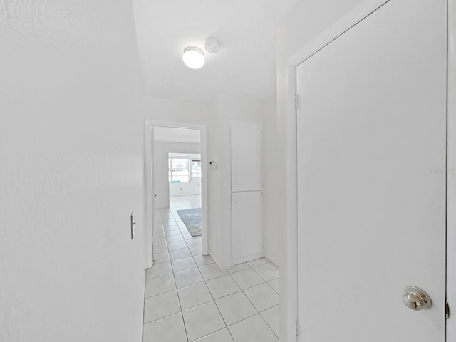 hall with light tile patterned flooring