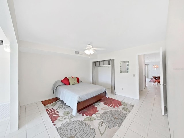 bedroom featuring ceiling fan, light tile patterned flooring, and visible vents