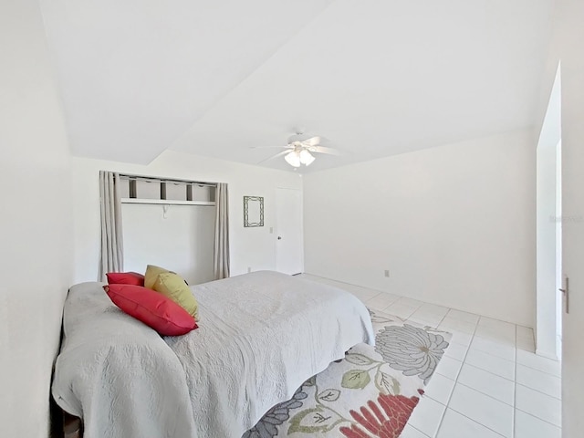 bedroom featuring light tile patterned floors and a ceiling fan