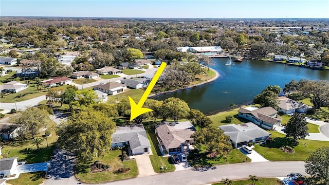 birds eye view of property featuring a water view and a residential view