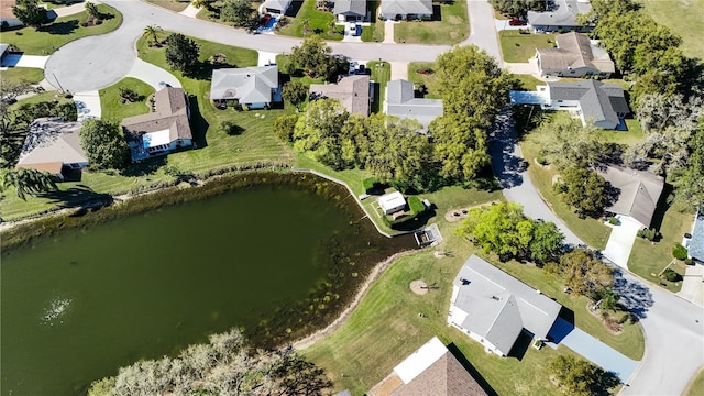 birds eye view of property featuring a water view and a residential view