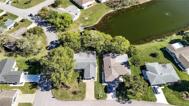 bird's eye view featuring a water view and a residential view