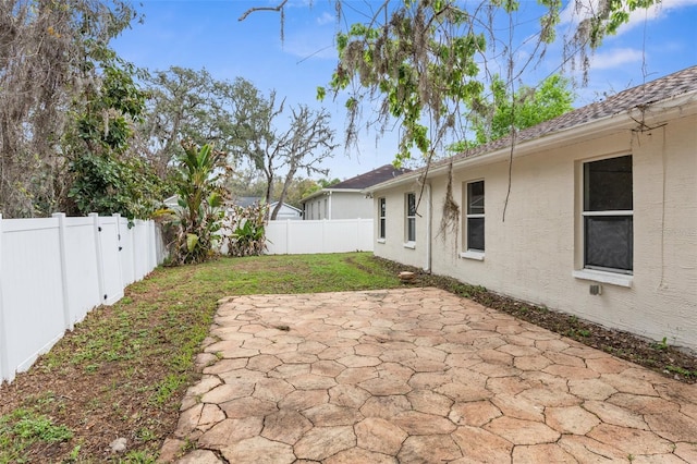 view of yard with a patio area and a fenced backyard