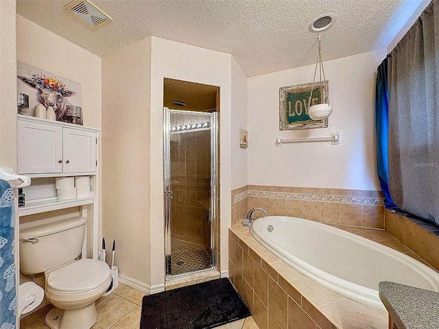 bathroom featuring a garden tub, toilet, visible vents, tile patterned floors, and a stall shower