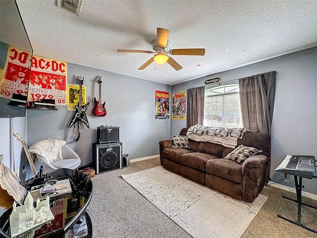 living area featuring baseboards, a textured ceiling, visible vents, and carpet flooring