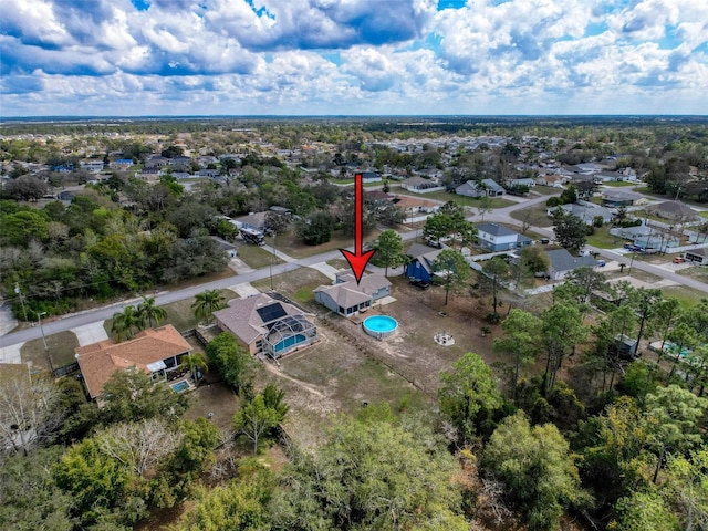 birds eye view of property with a residential view