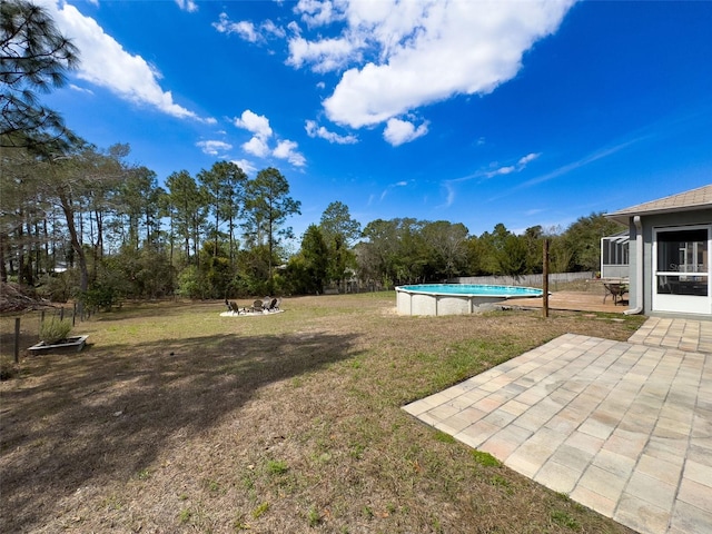 view of yard with a patio area and an outdoor pool