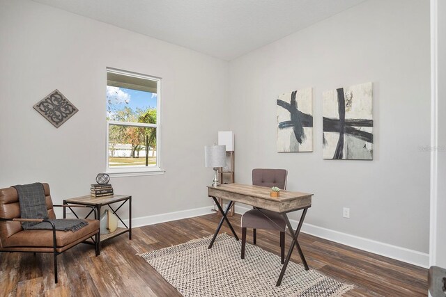 home office featuring baseboards and dark wood-style floors