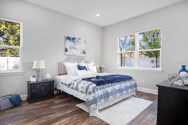 bedroom featuring recessed lighting, wood finished floors, and baseboards