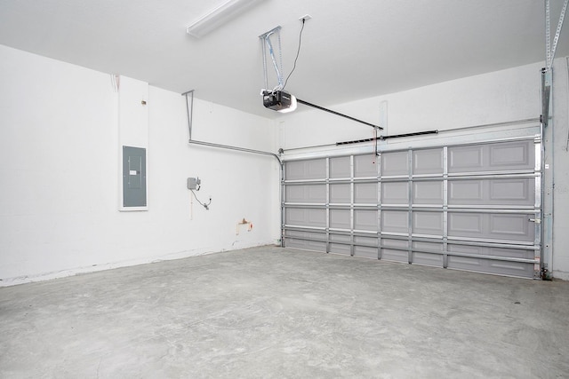 garage featuring electric panel and a garage door opener