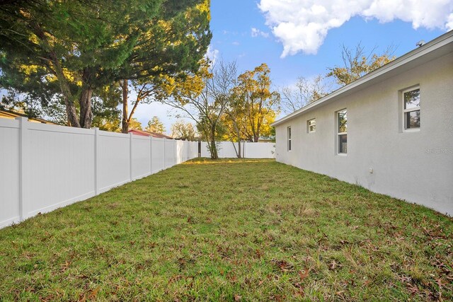view of yard with a fenced backyard
