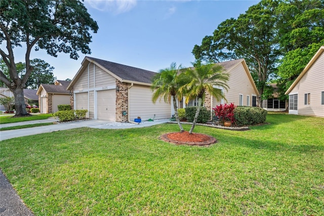 ranch-style home with driveway, a garage, and a front yard