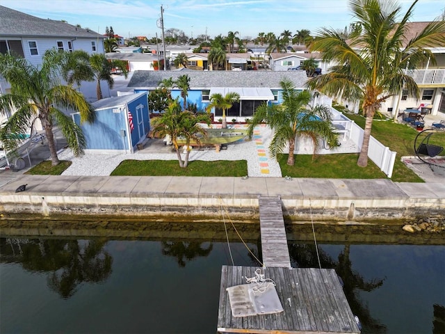 aerial view with a residential view and a water view