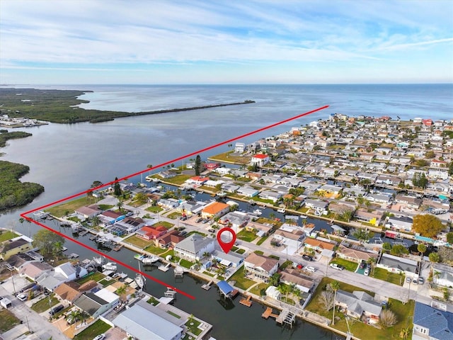 drone / aerial view with a water view and a residential view