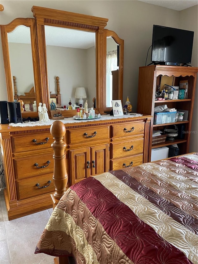 bedroom featuring light tile patterned floors