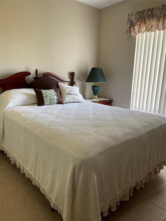 bedroom featuring tile patterned floors