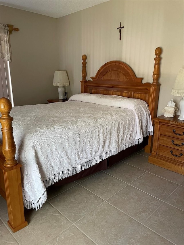 bedroom with tile patterned floors