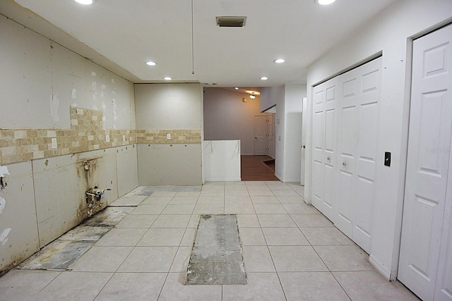 interior space with recessed lighting and light tile patterned floors