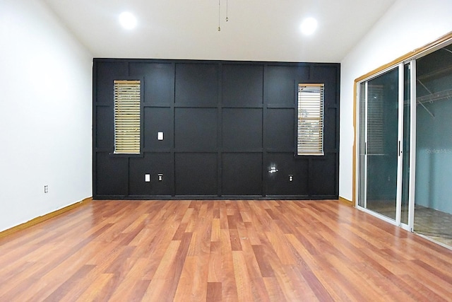 spare room featuring recessed lighting and light wood-style flooring