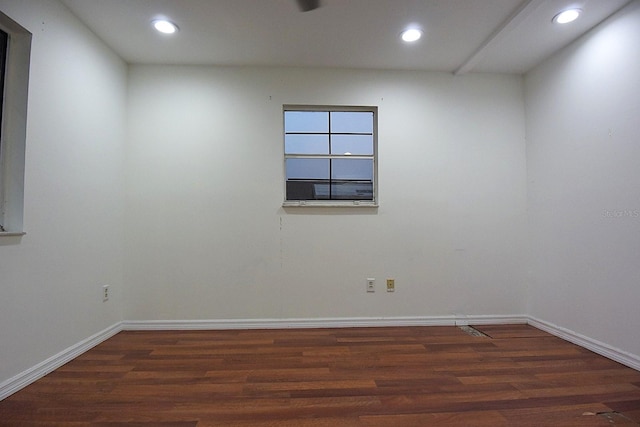 spare room with wood finished floors and recessed lighting