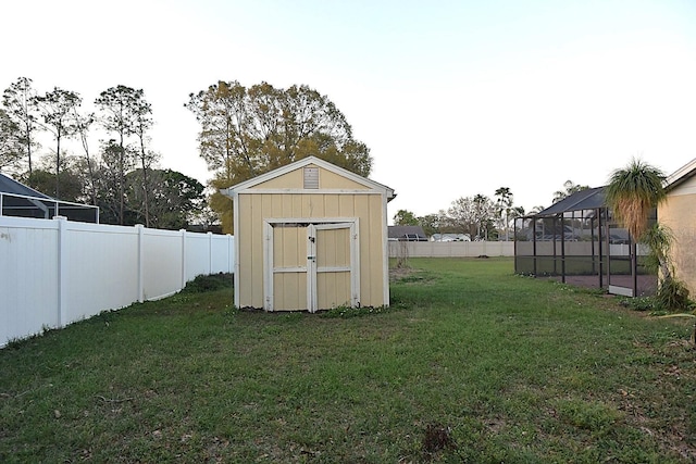 view of shed featuring a fenced backyard