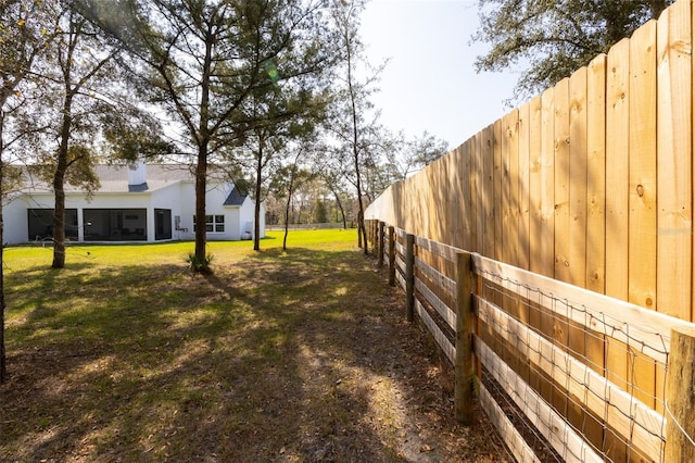 view of yard featuring fence