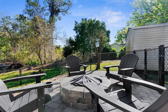 view of patio with a fenced backyard and an outdoor fire pit