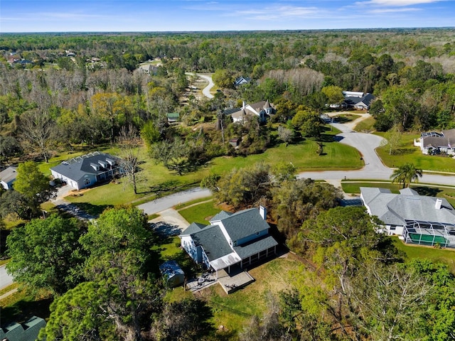 bird's eye view with a forest view and a residential view