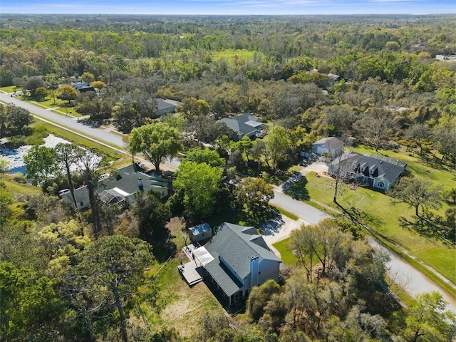 birds eye view of property with a wooded view