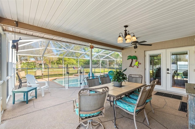 view of patio / terrace featuring a ceiling fan, french doors, an outdoor pool, outdoor dining area, and a lanai