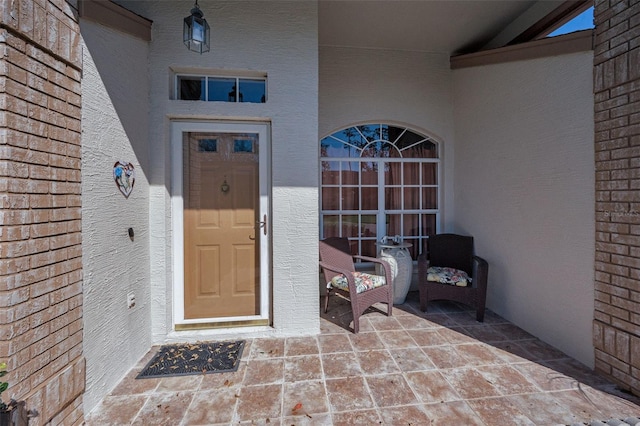 entrance to property with brick siding