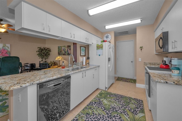 kitchen with visible vents, range with electric stovetop, a sink, black dishwasher, and a textured ceiling