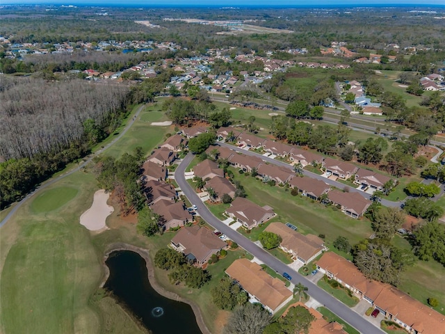 aerial view with a residential view, a water view, and view of golf course