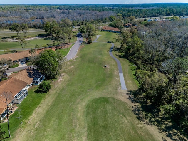 birds eye view of property featuring a wooded view