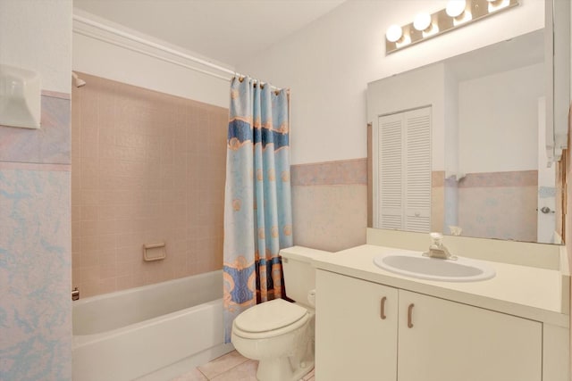 bathroom featuring vanity, toilet, shower / tub combo, and tile patterned flooring