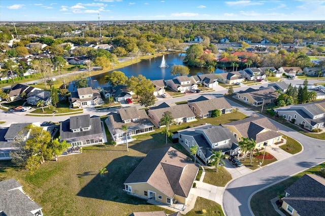 birds eye view of property with a residential view and a water view