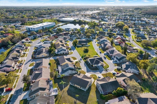 birds eye view of property featuring a residential view and a water view