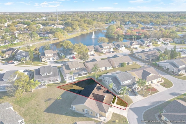 bird's eye view with a residential view and a water view