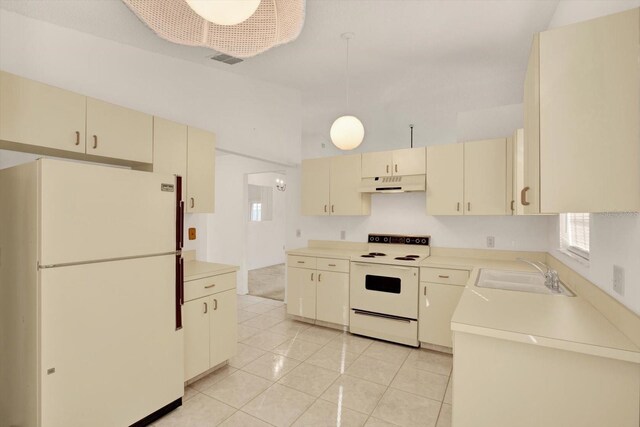 4208 Boston Cir, New Port Richey, FL 34653 - kitchen featuring white appliances, under cabinet range hood, a sink, cream cabinets, and light tile patterned floors