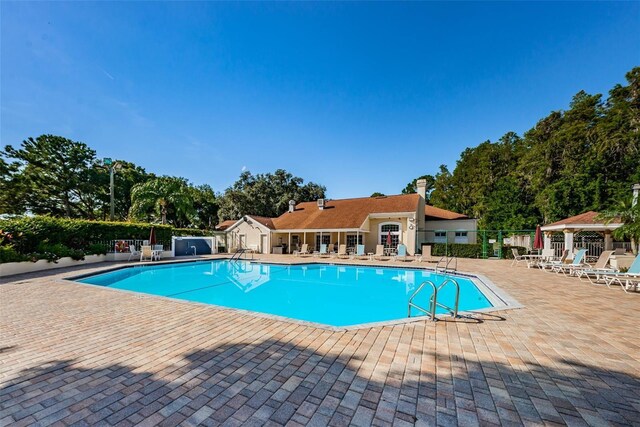 4208 Boston Cir, New Port Richey, FL 34653 - community pool with a patio and view of wooded area