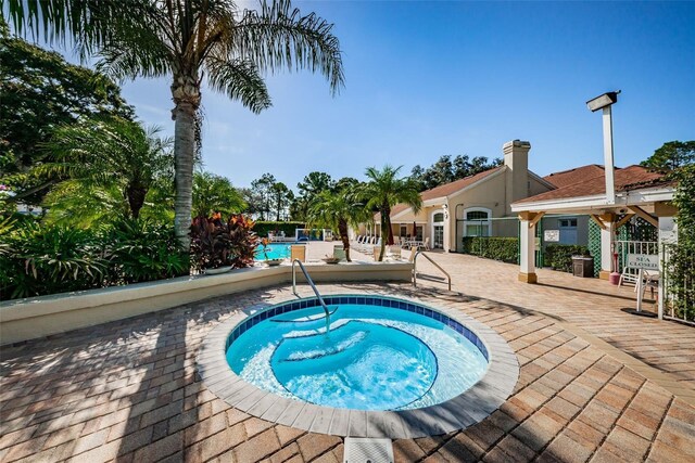 4208 Boston Cir, New Port Richey, FL 34653 - community pool with a community hot tub and a patio area