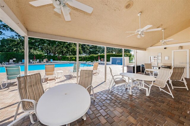 4208 Boston Cir, New Port Richey, FL 34653 - view of patio / terrace with a ceiling fan, outdoor dining space, and a community pool