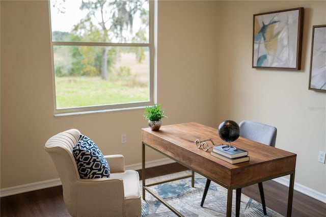 home office with baseboards and wood finished floors