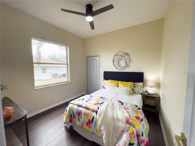 bedroom featuring ceiling fan, baseboards, and wood finished floors