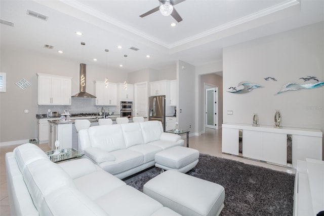 living area featuring crown molding, visible vents, and recessed lighting