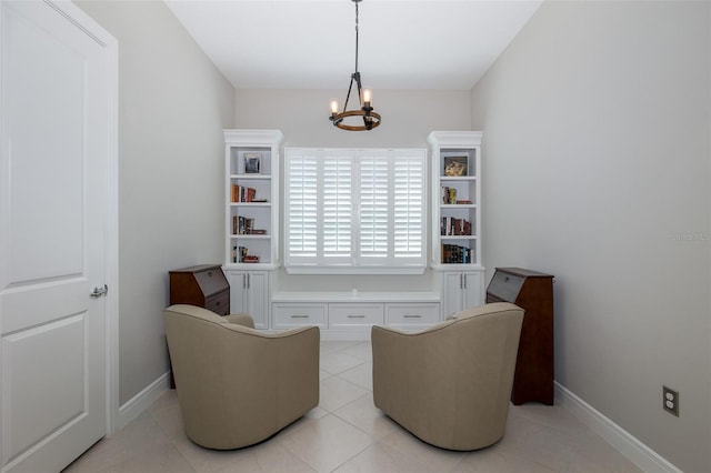 living area with a chandelier, light tile patterned flooring, and baseboards