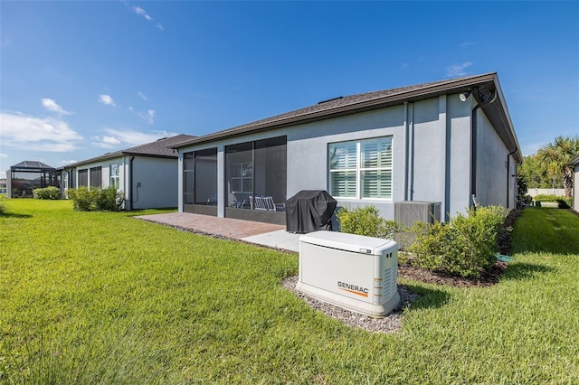 rear view of house featuring a sunroom, central AC, a lawn, and stucco siding